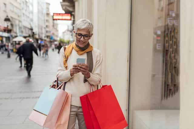 women with shopping card